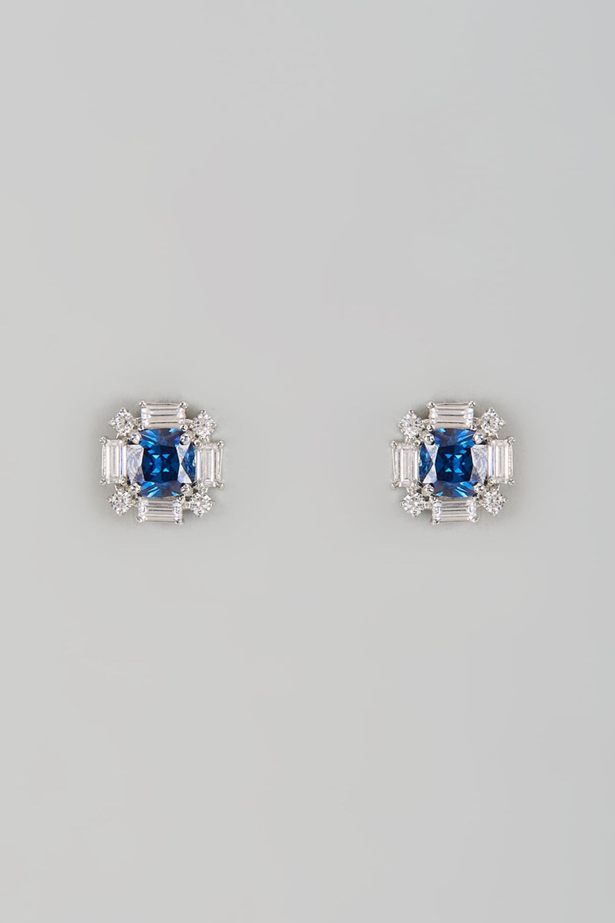 White Finish Halo Diamond & Blue Sapphire Stone Stud Earrings In Sterling Silver