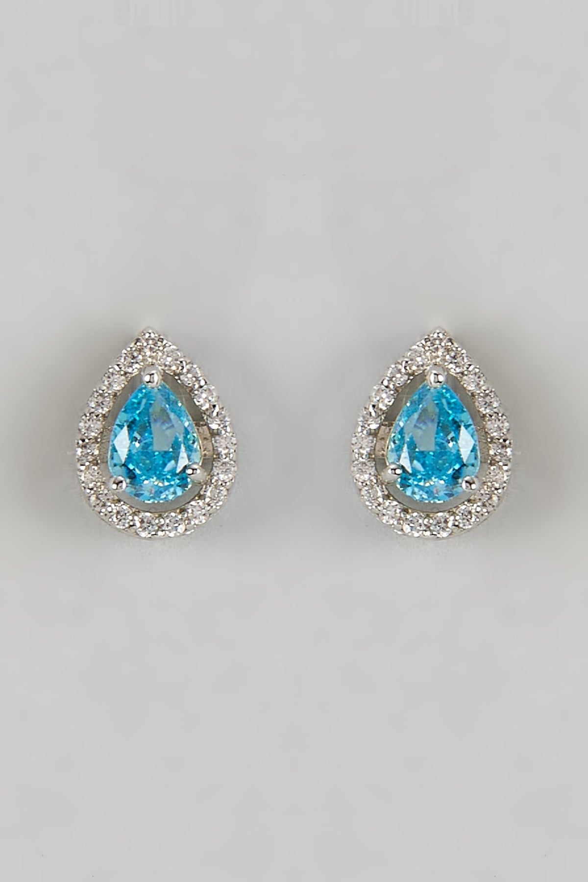 White Finish Halo Diamond & Aquamarine Gemstone Pear-Shaped Stud Earrings In Sterling Silver