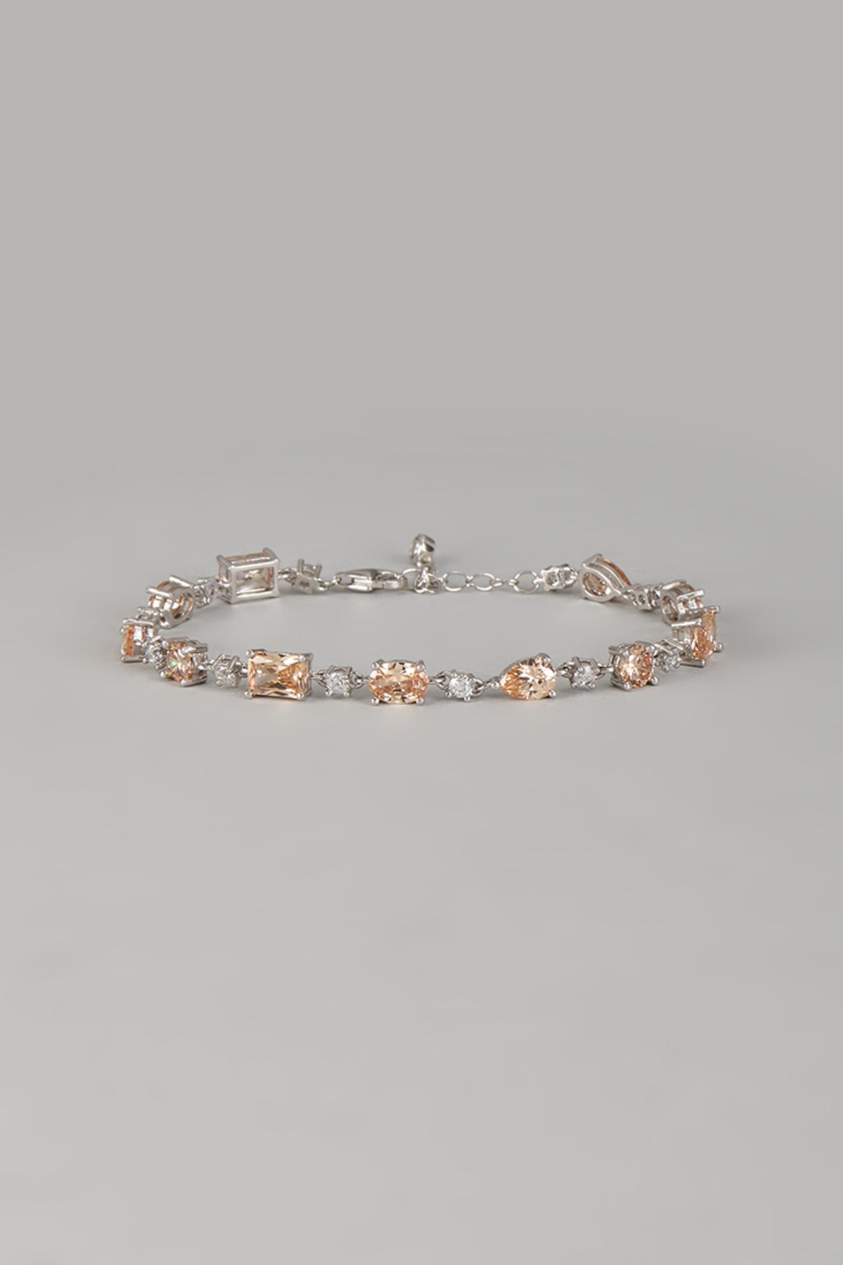 White Finish Orange Gemstone Tennis Bracelet In Sterling Silver