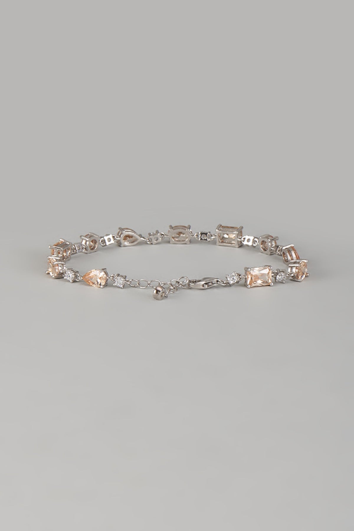 White Finish Orange Gemstone Tennis Bracelet In Sterling Silver