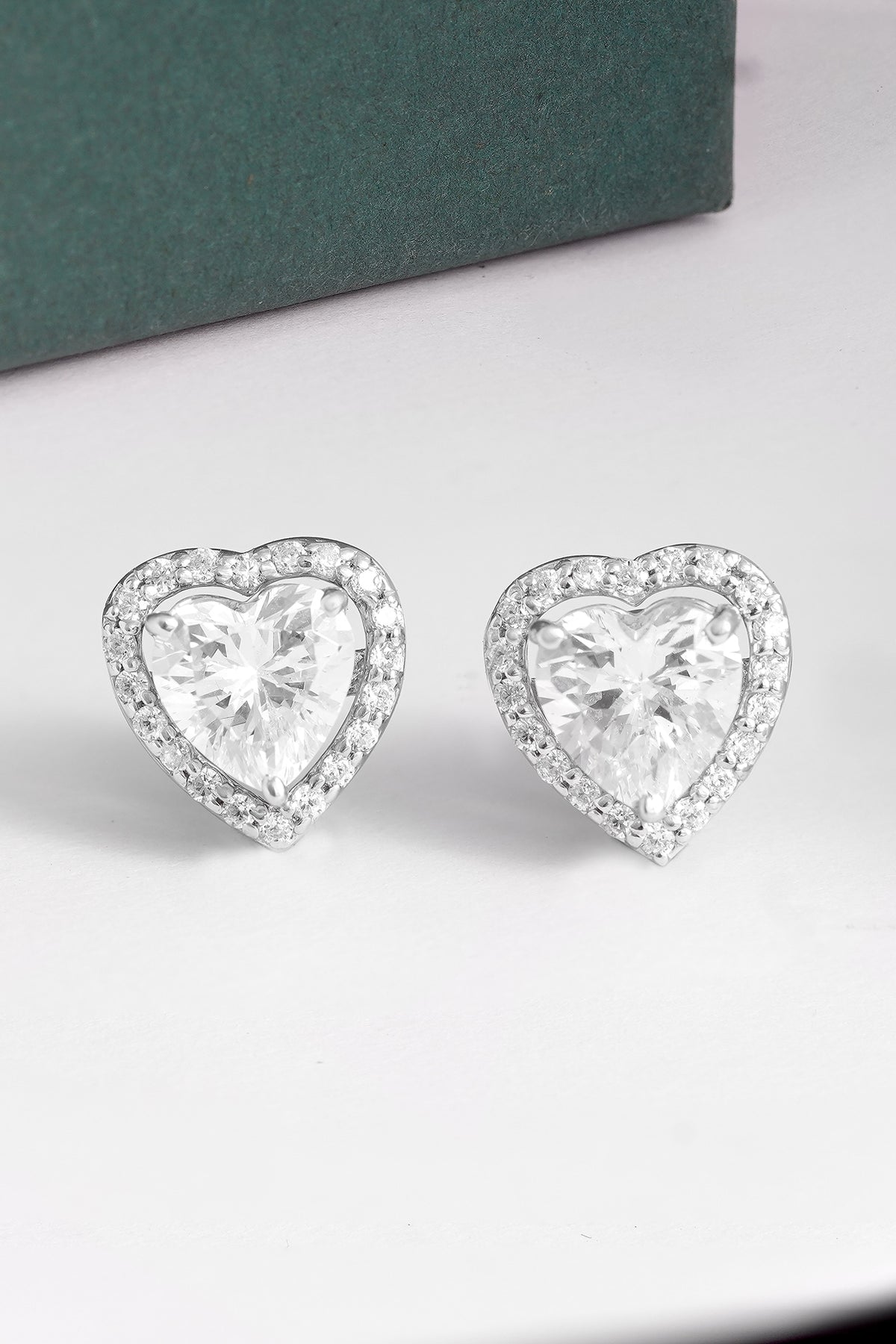 White Finish Cubic Zirconia Heart Stud Earrings In Sterling Silver