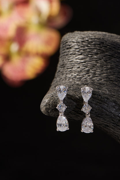 White Finish CZ Dangler Earrings In Sterling Silver