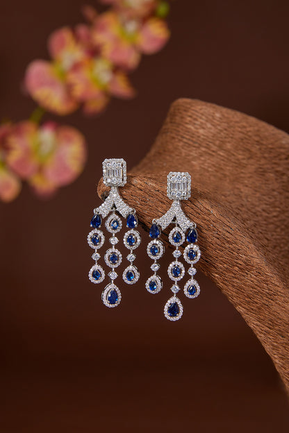 White Finish Zircon & Synthetic Blue Sapphire Dangler Earrings In Sterling Silver