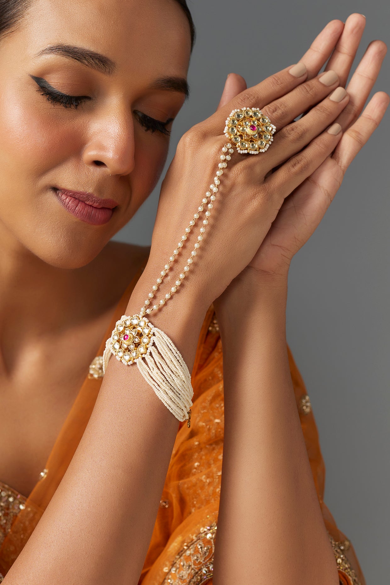 Gold Finish Pink Kundan Polki & Pearl Hand Harness