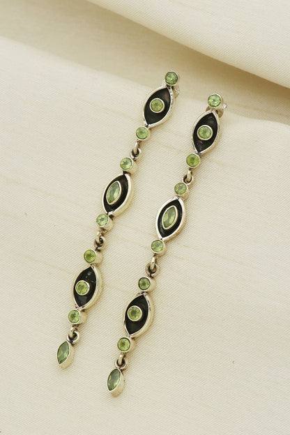 White Finish Peridot Eye Dangler Earrings In Sterling Silver