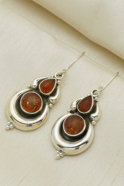 White Finish Orange Amber Stone Dangler Earrings In Sterling Silver