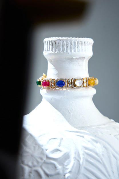 Gold Finish Navratna Gemstone Bracelet In Sterling Silver