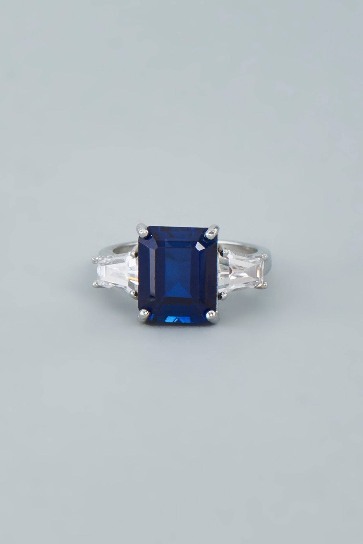 White Finish Blue Swarovski Baguette Emerald Cut Ring In Sterling Silver