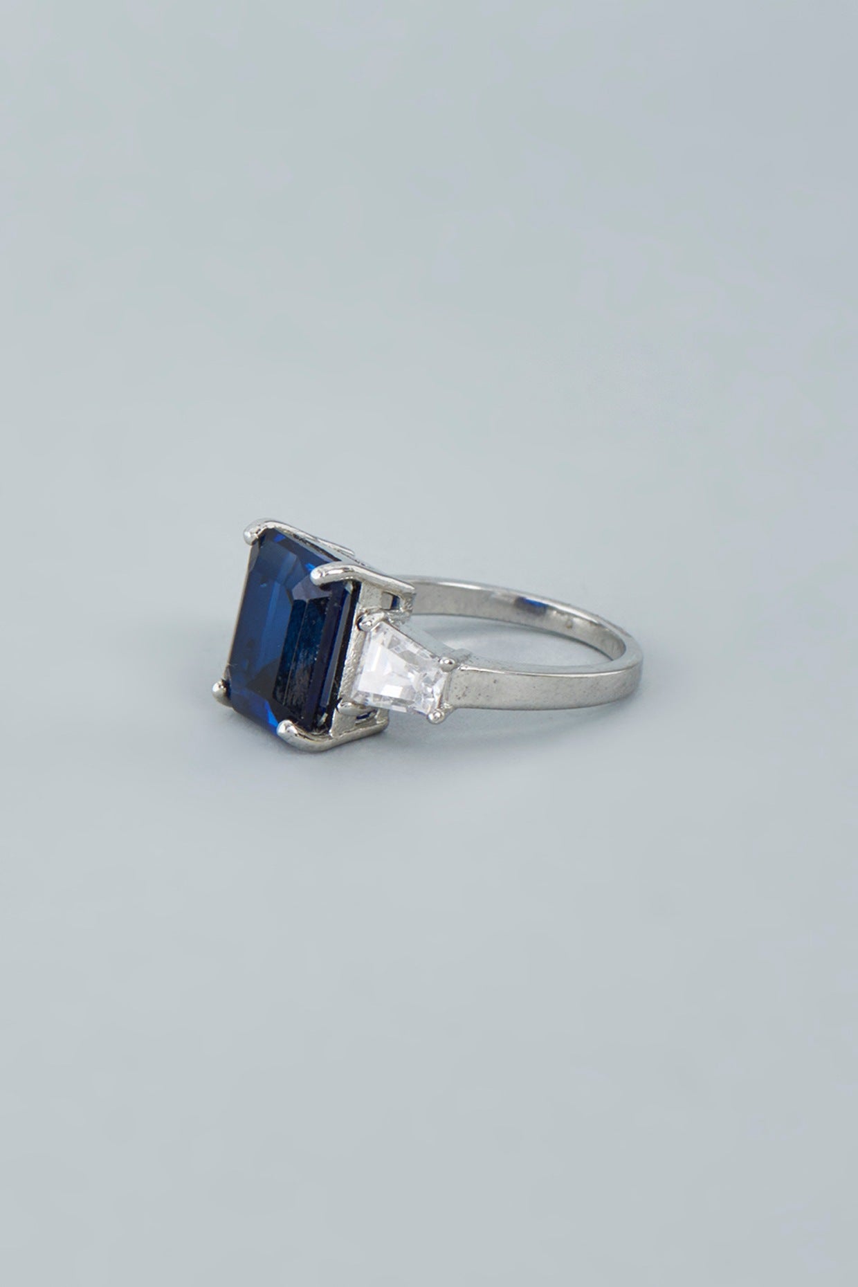 White Finish Blue Swarovski Baguette Emerald Cut Ring In Sterling Silver