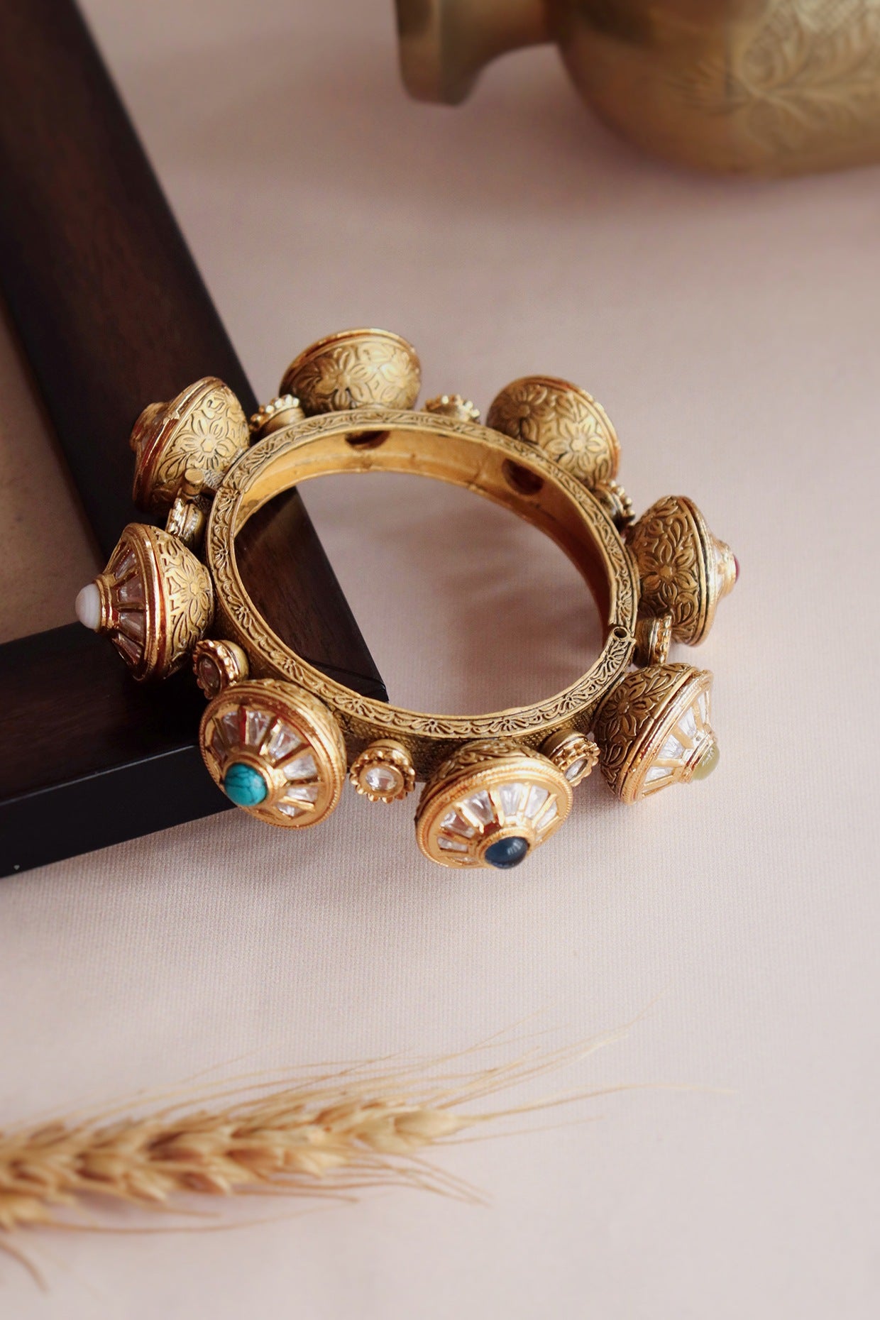 Gold Finish Handcrafted Bangle With Navratna Stone