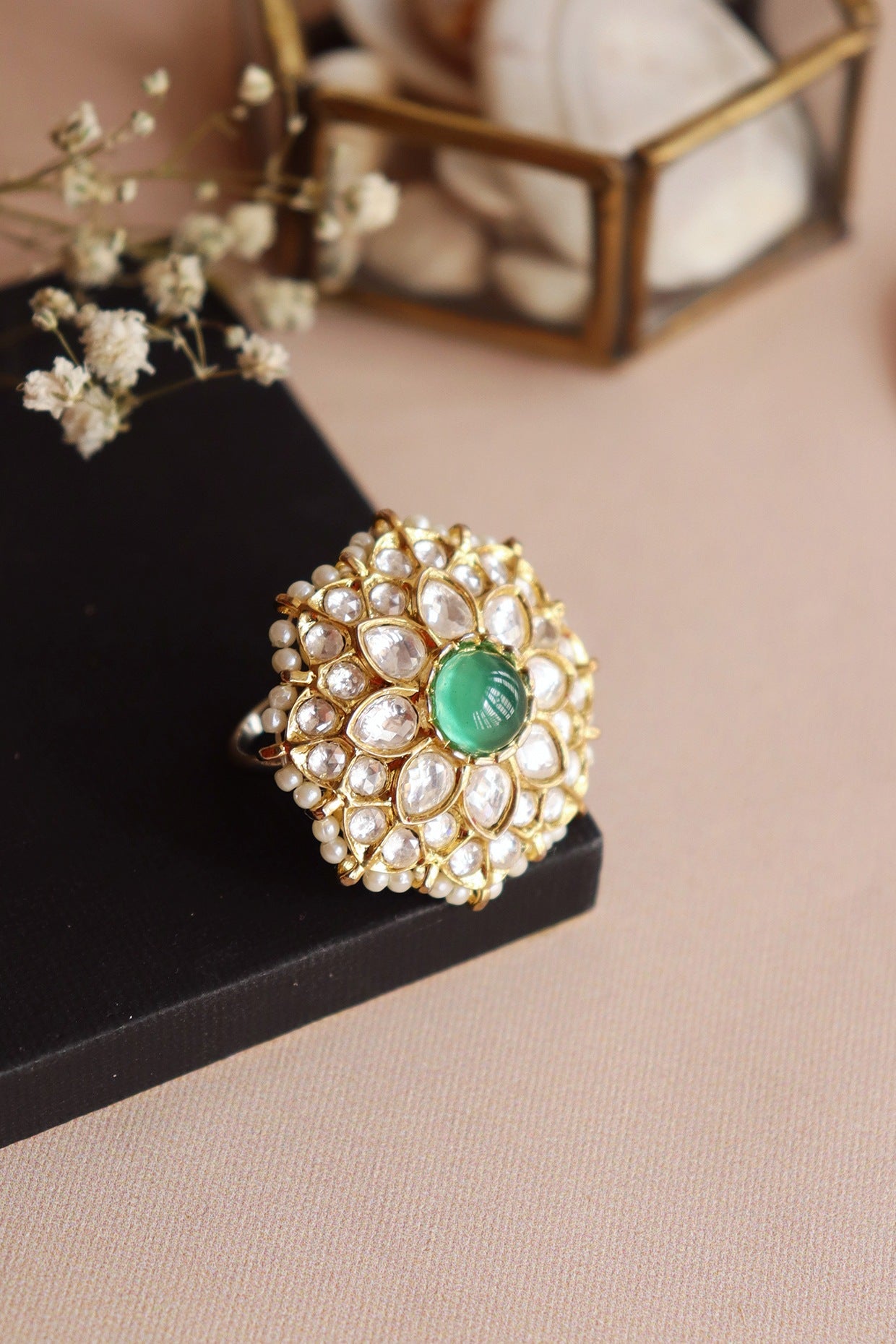 Gold Finish Handcrafted Ring With Green Stones