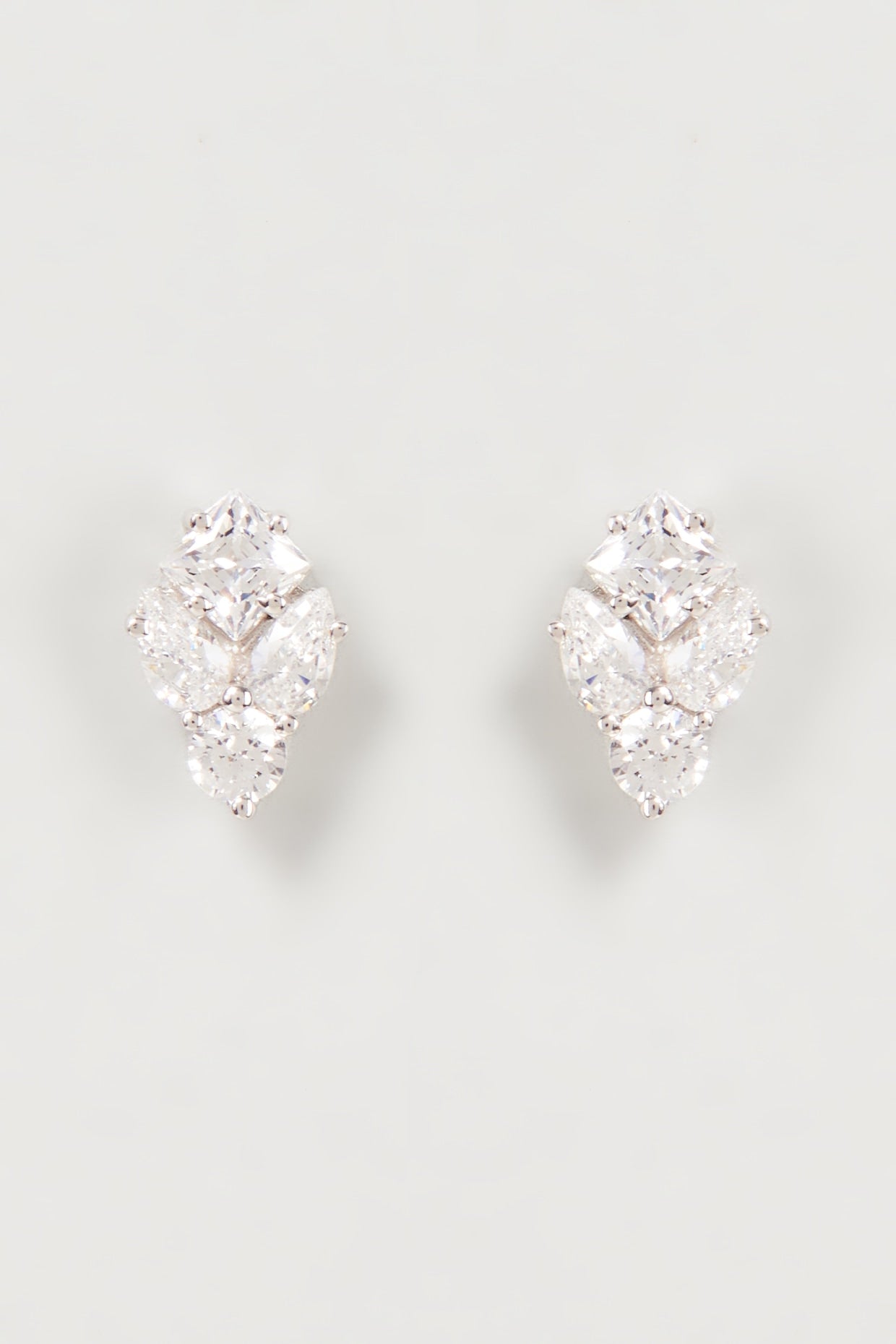 White Finish Swarovski Zirconia Stud Earrings In Sterling Silver