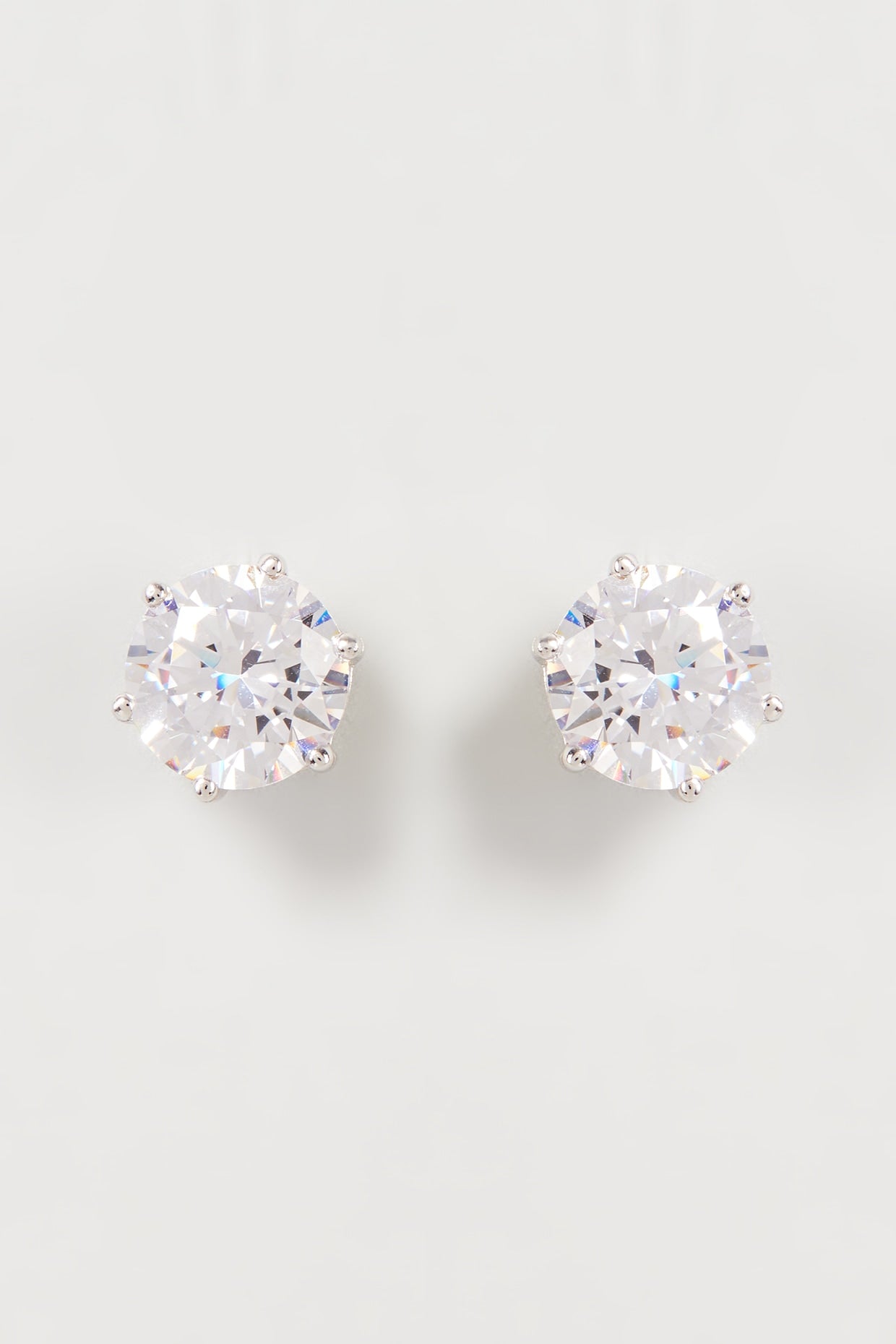 White Finish Swarovski Zirconia Stud Earrings In Sterling Silver