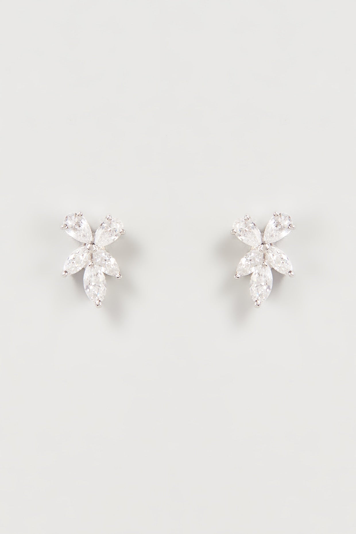 White Finish Swarovski Zirconia Stud Earrings In Sterling Silver