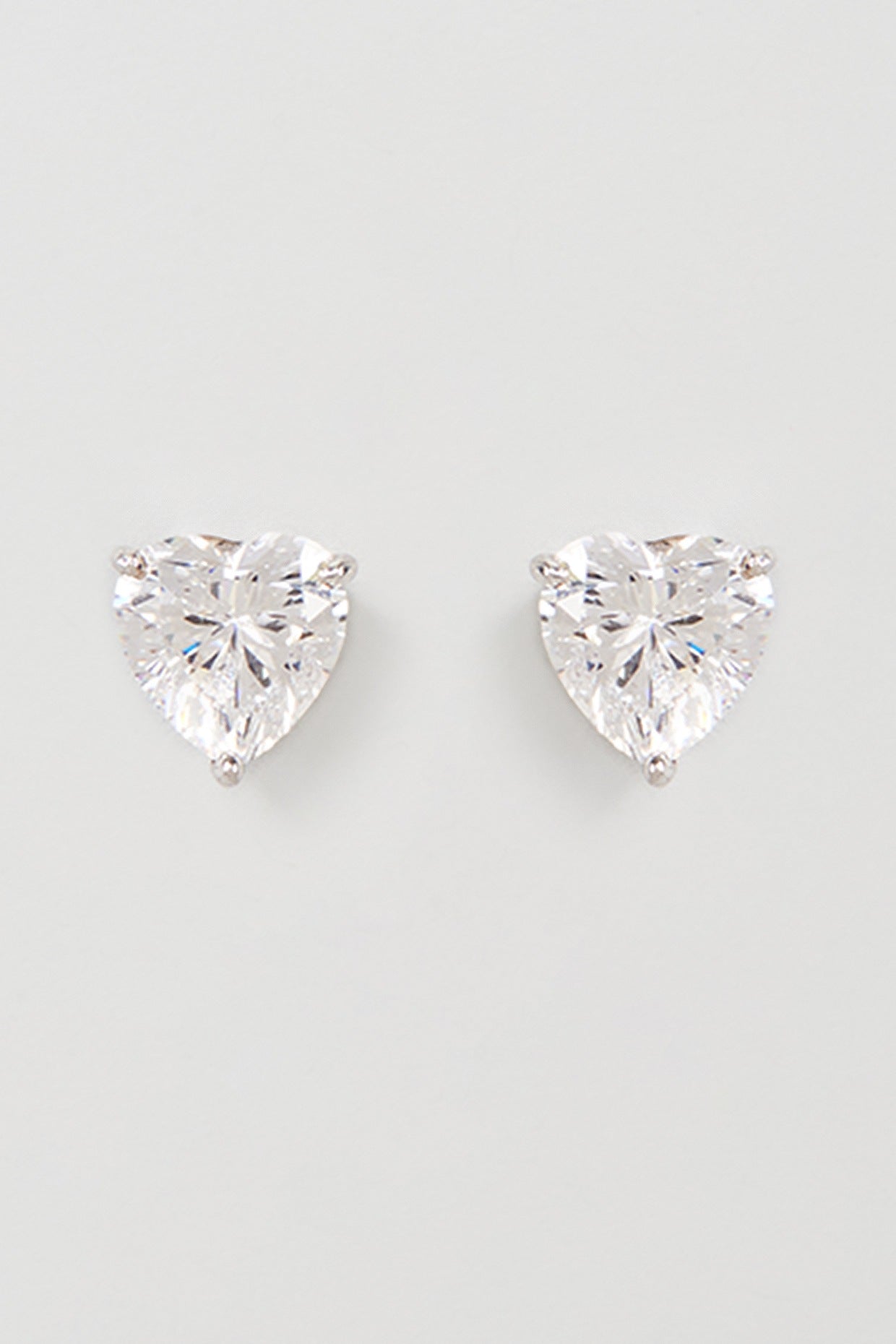 White Finish Swarovski Zirconia Stud Earrings In Sterling Silver