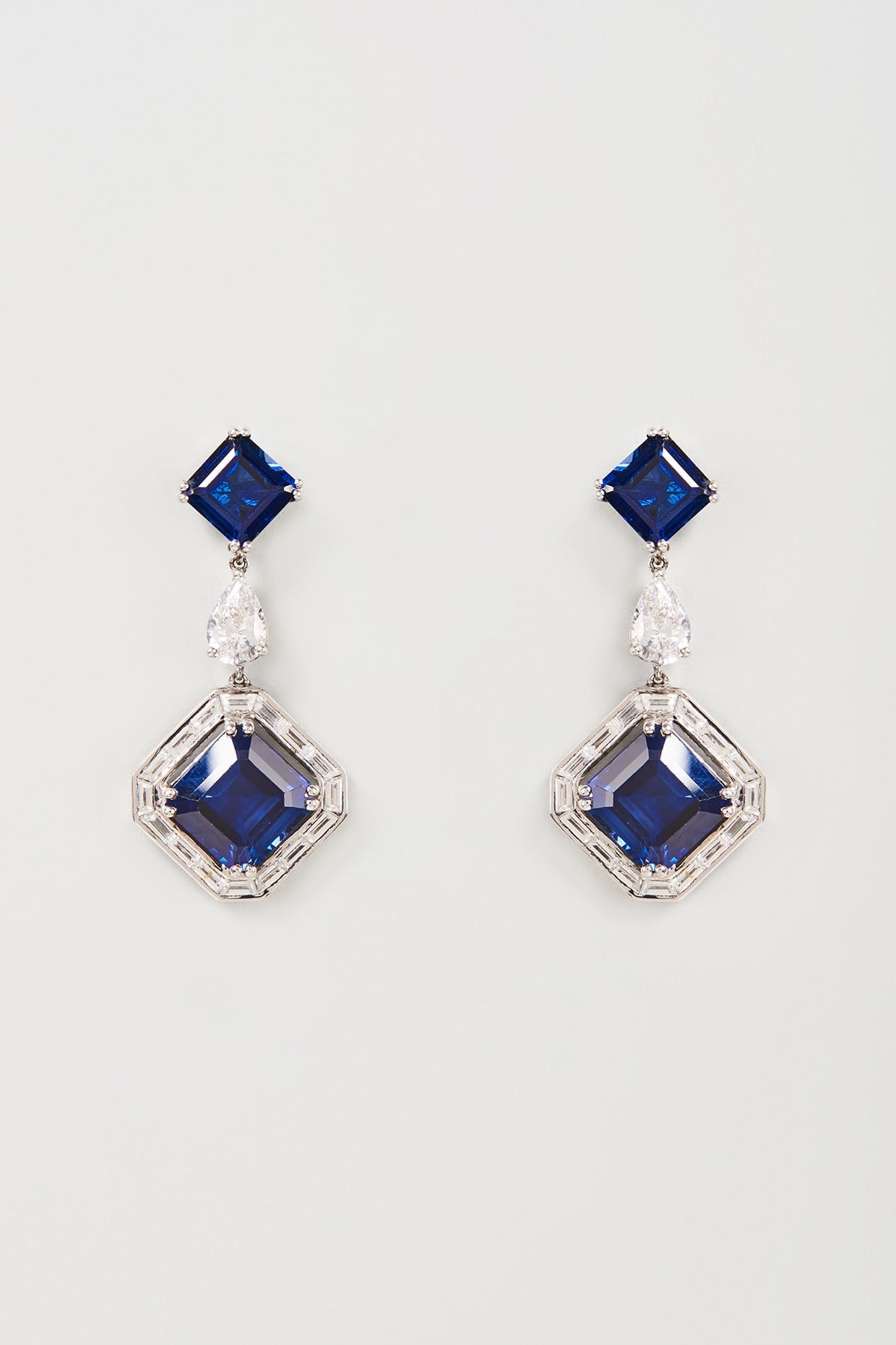 White Finish White & Blue Swarovski Zirconia Dangler Earrings In Sterling Silver