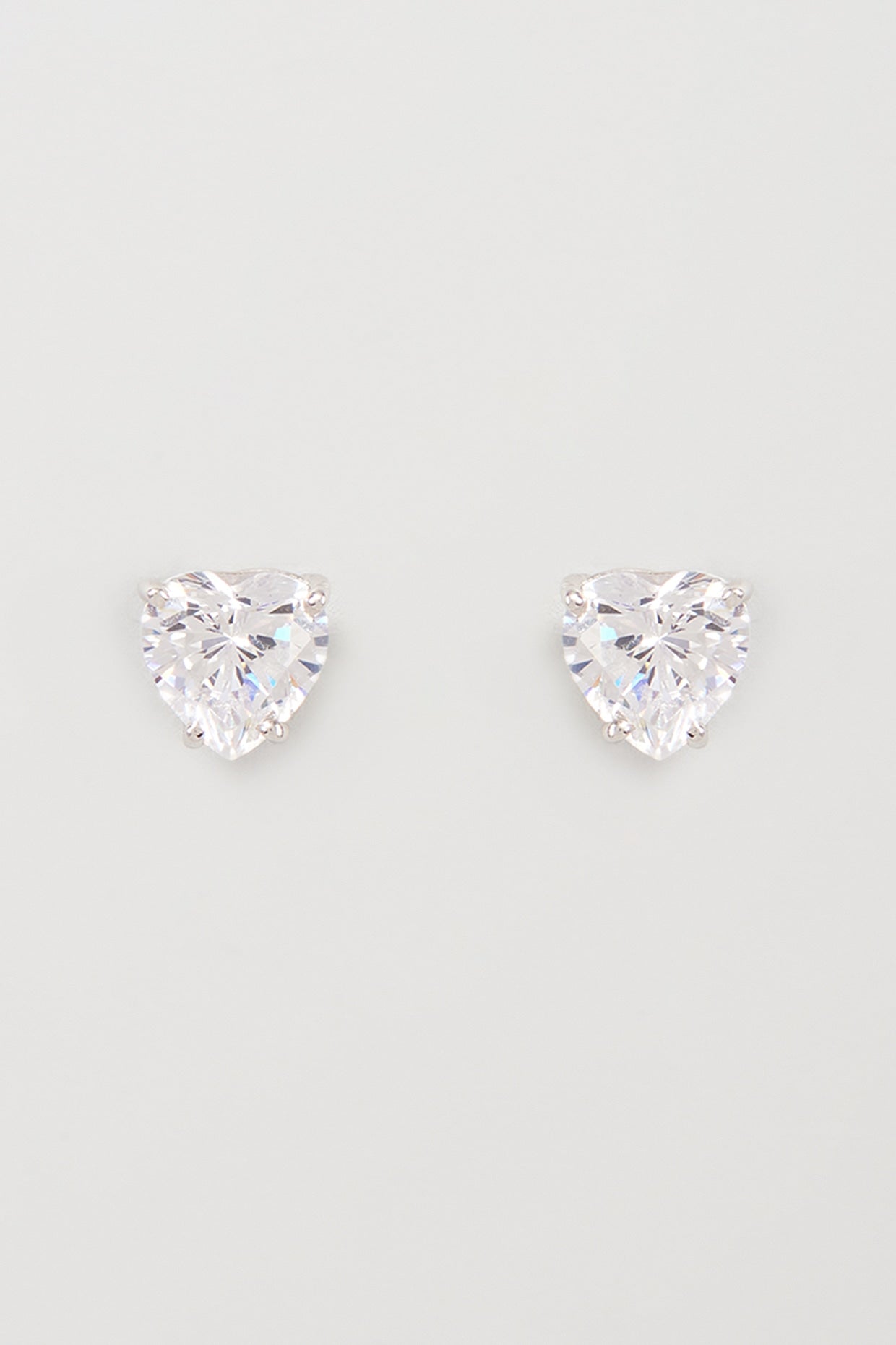 White Finish Swarovski Zirconia Stud Earrings In Sterling Silver