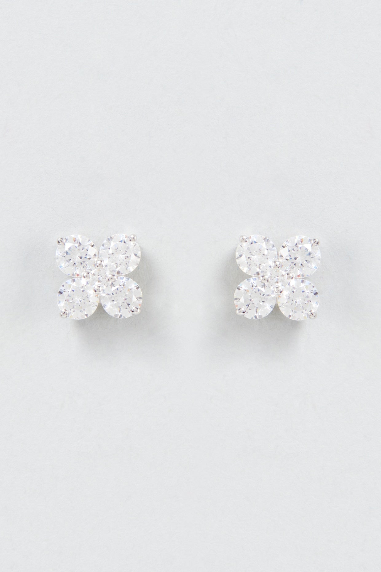 White Finish Swarovski Zirconia Stud Earrings In Sterling Silver