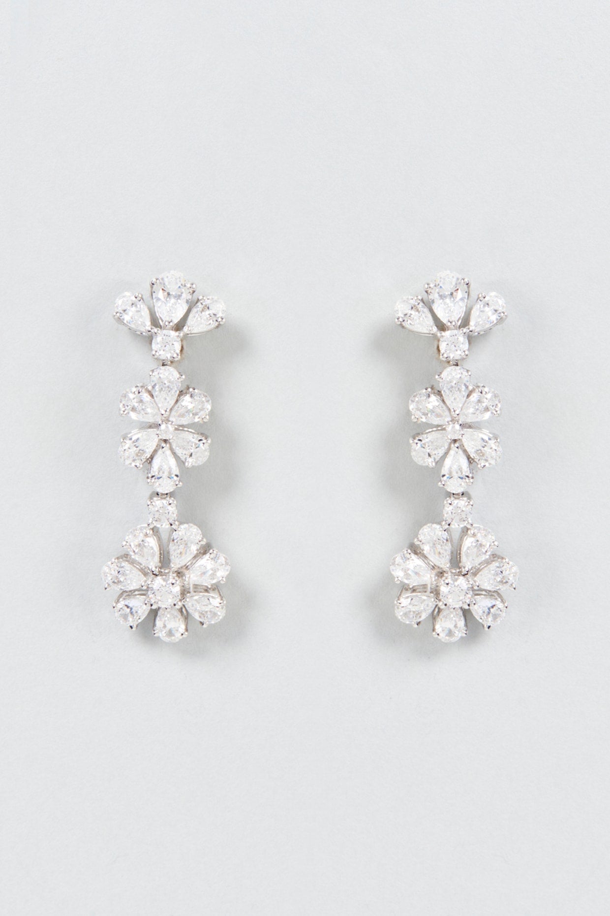 White Finish Swarovski Zirconia Dangler Earrings In Sterling Silver