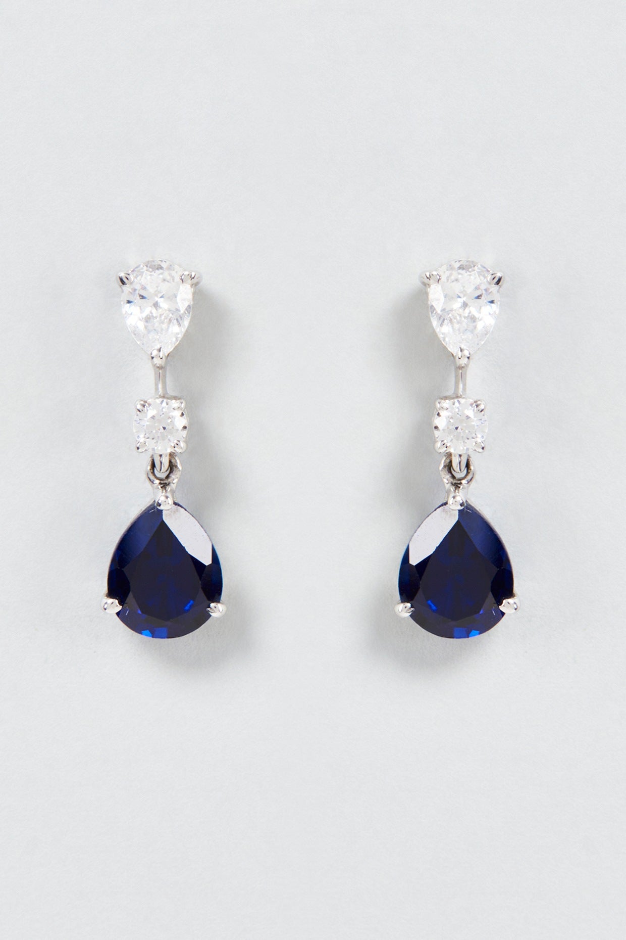 White Finish White & Blue Pear Cut Swarovski Zirconia Dangler Earrings In Sterling Silver