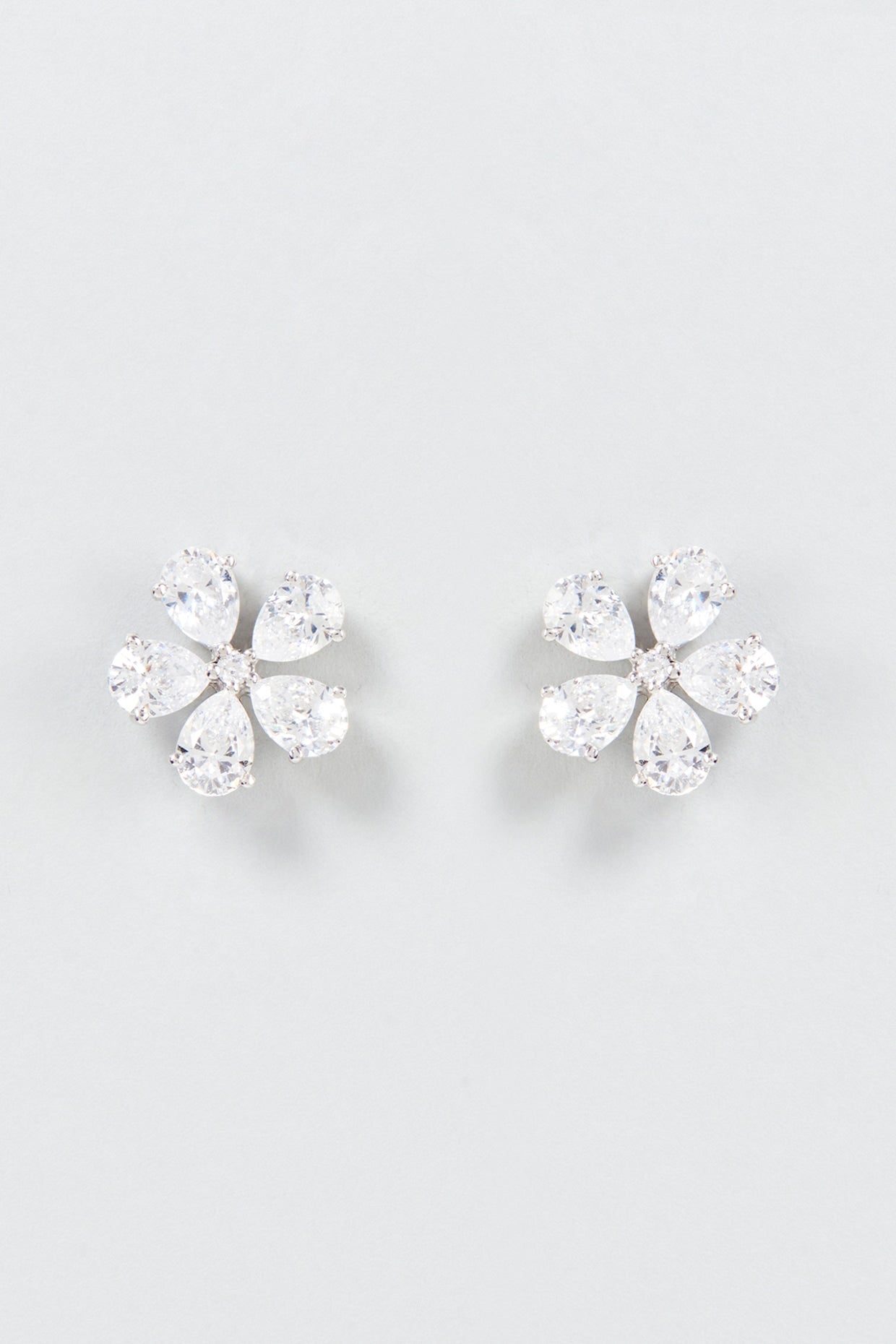 White Finish Swarovski Zirconia Stud Earrings In Sterling Silver