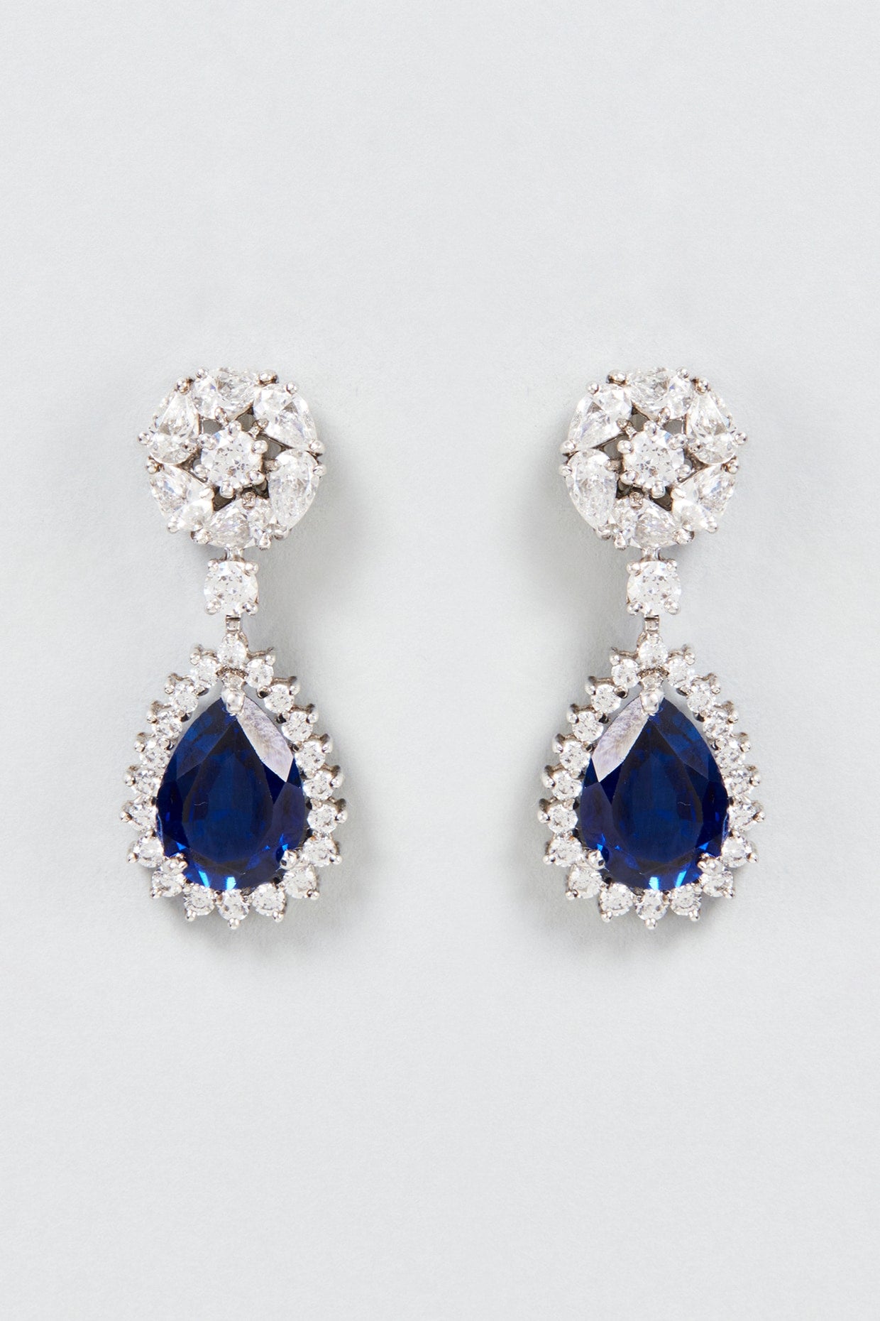 White Finish White & Blue Round Cut Swarovski Zirconia Dangler Earrings In Sterling Silver