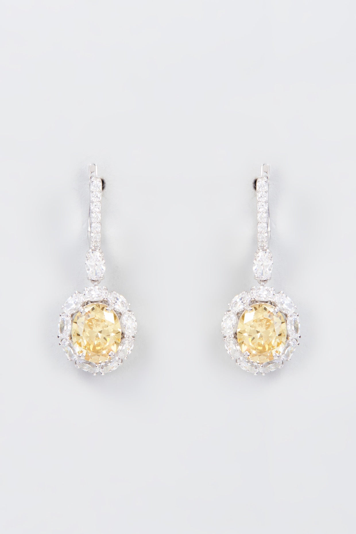 White Finish Zircon & Synthetic Yellow Stone Dangler Earrings In Sterling Silver