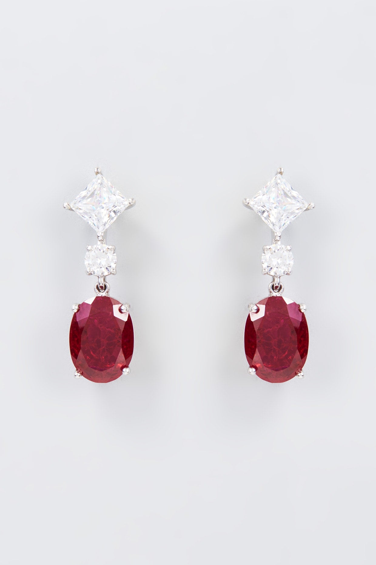 White Finish Zircon & Synthetic Red Stone Dangler Earrings In Sterling Silver