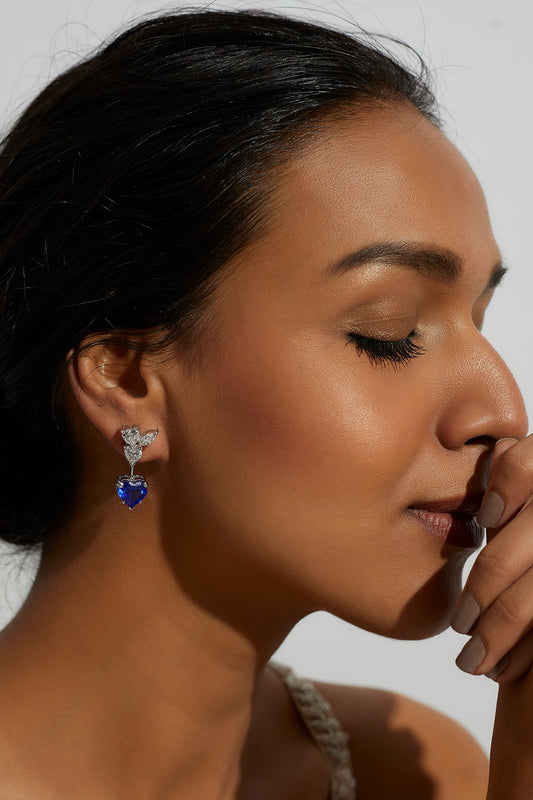 White Finish Zircon & Synthetic Blue Stone Dangler Earrings In Sterling Silver