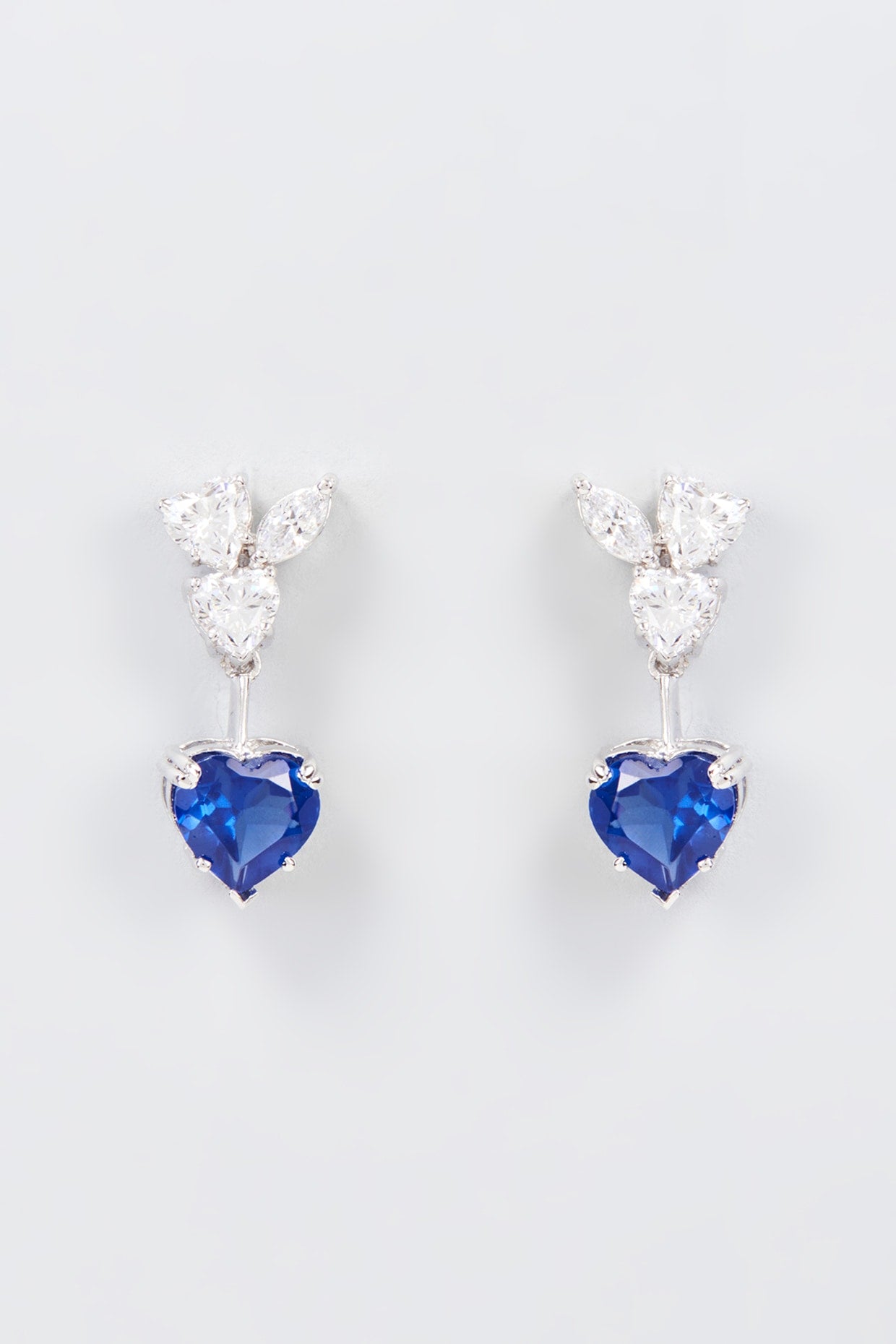 White Finish Zircon & Synthetic Blue Stone Dangler Earrings In Sterling Silver