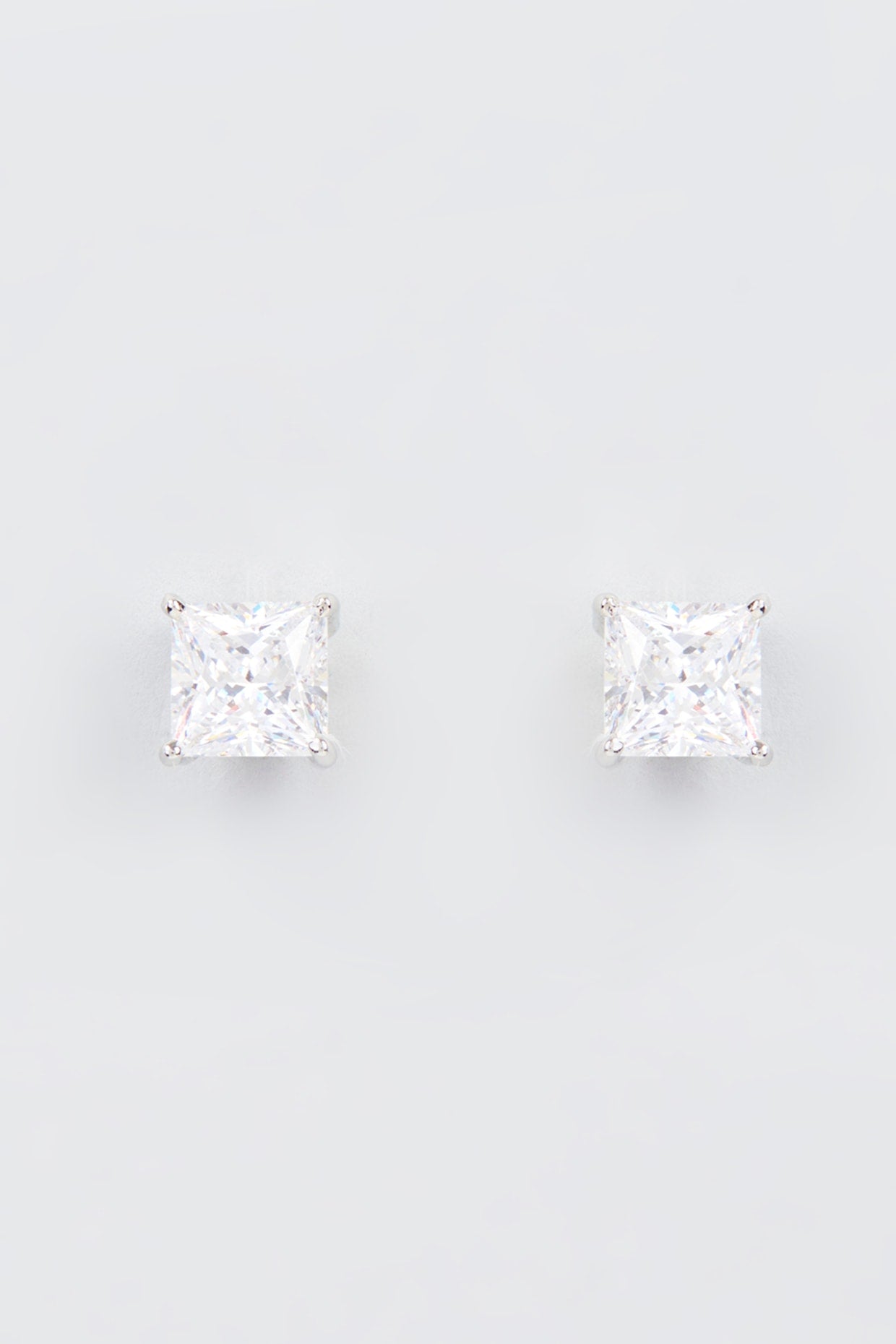 White Finish Zircon Stud Earrings In Sterling Silver