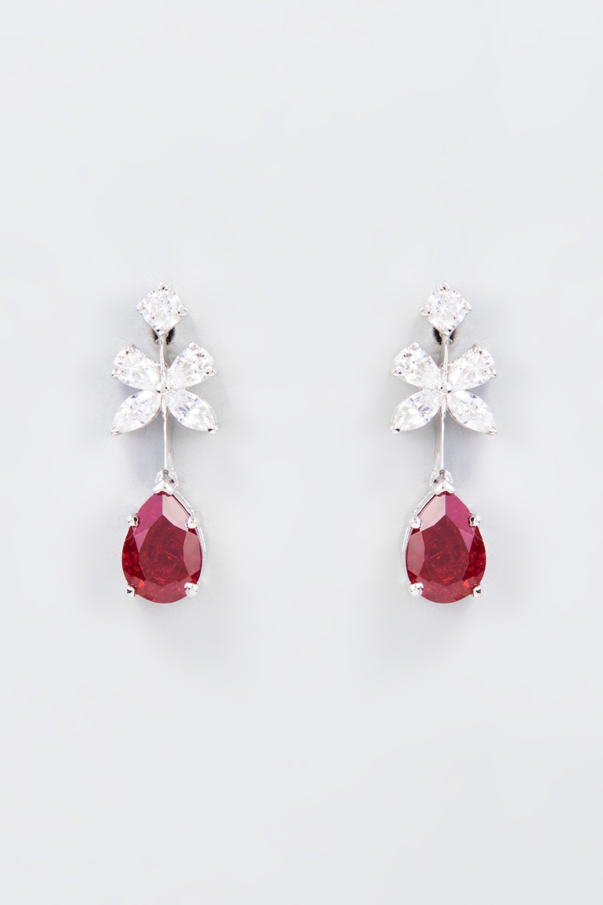 White Finish Zircon & Synthetic Red Stone Dangler Earrings In Sterling Silver