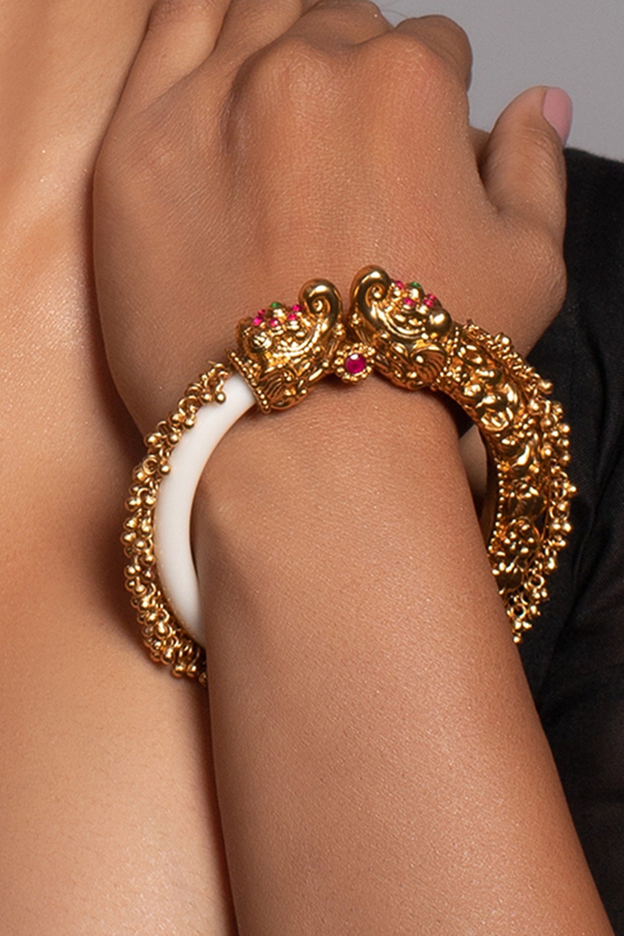 Gold Finish Bangle With A Red Stone