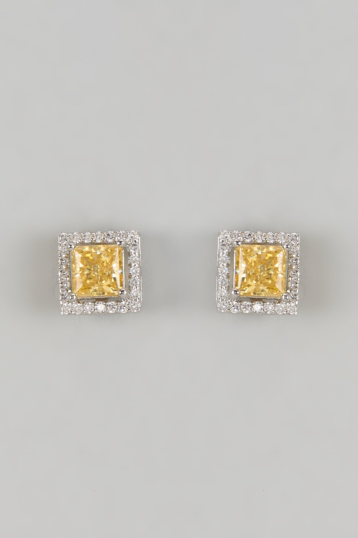 White Finish Halo Diamond & Yellow Sapphire Stone Stud Earrings In Sterling Silver