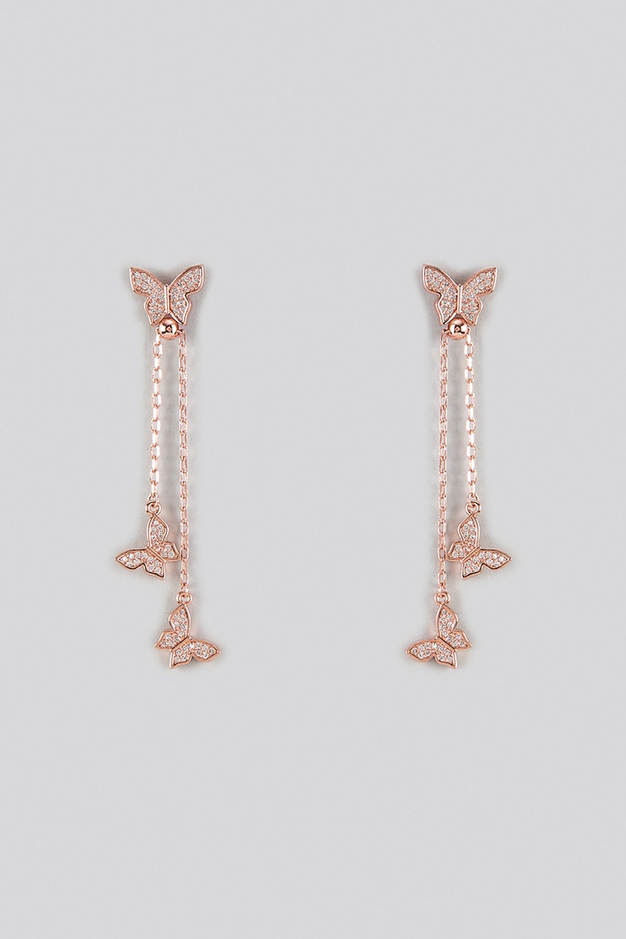 Rose Gold Finish Cubic Zirconia Dangler Earrings With Ring