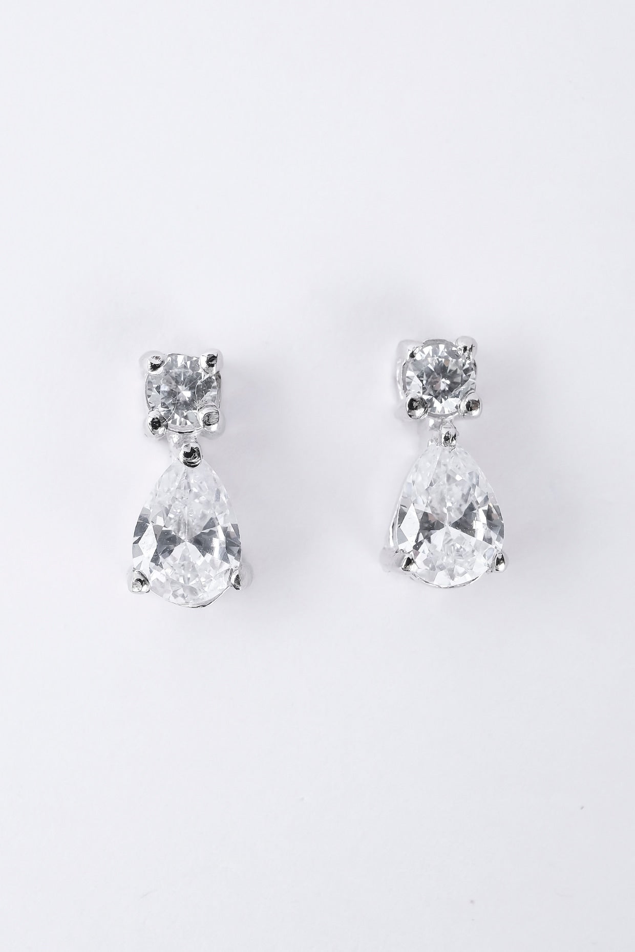 White Rhodium Plated Zircon Stud Earrings In Sterling Silver