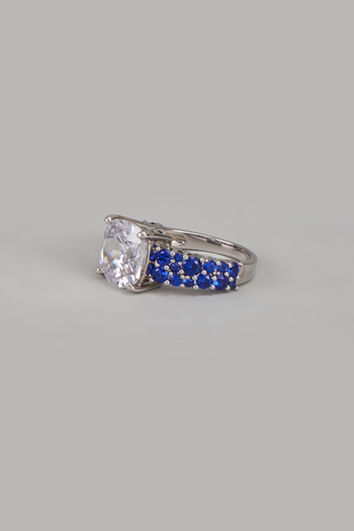 White Finish Zircon & Blue Stone Solitaire Ring