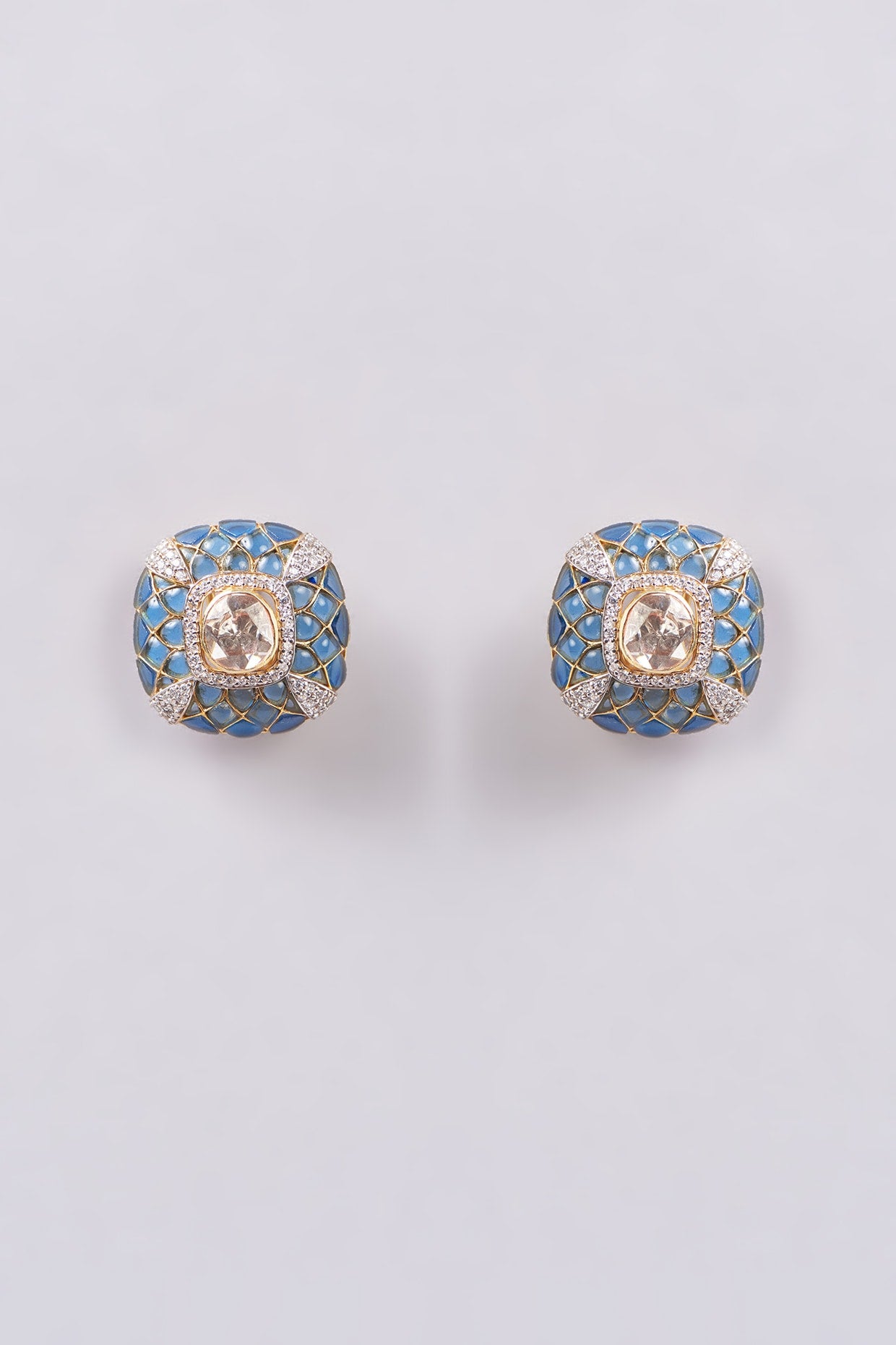 Gold Finish Blue Synthetic Stone Stud Earrings In Sterling Silver