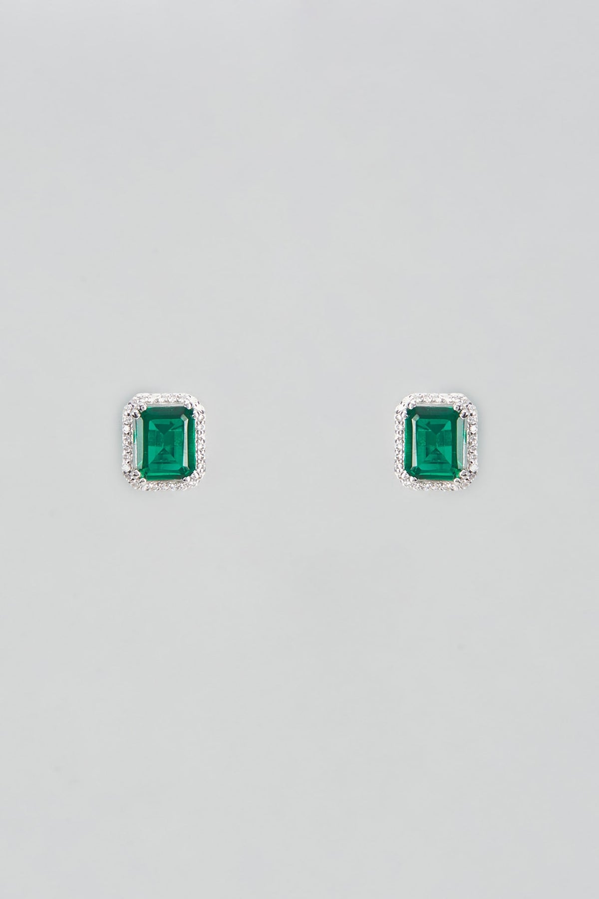 White Plated Cubic Zircons & Emerald Stud Earrings In Sterling Silver